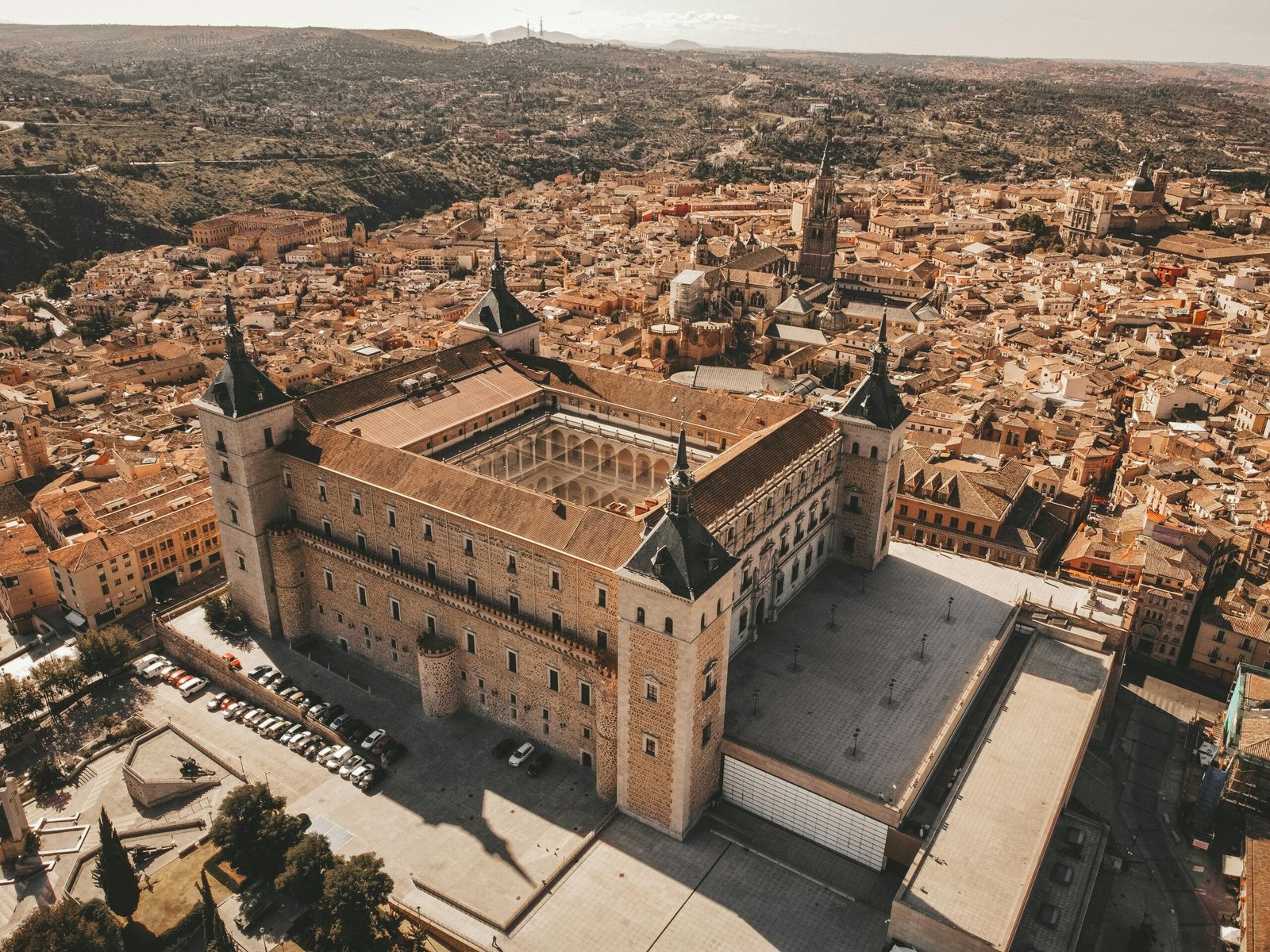 Stunning aerial view of Alcázar of Toledo, showcasing historic architecture and cityscape in Spain.