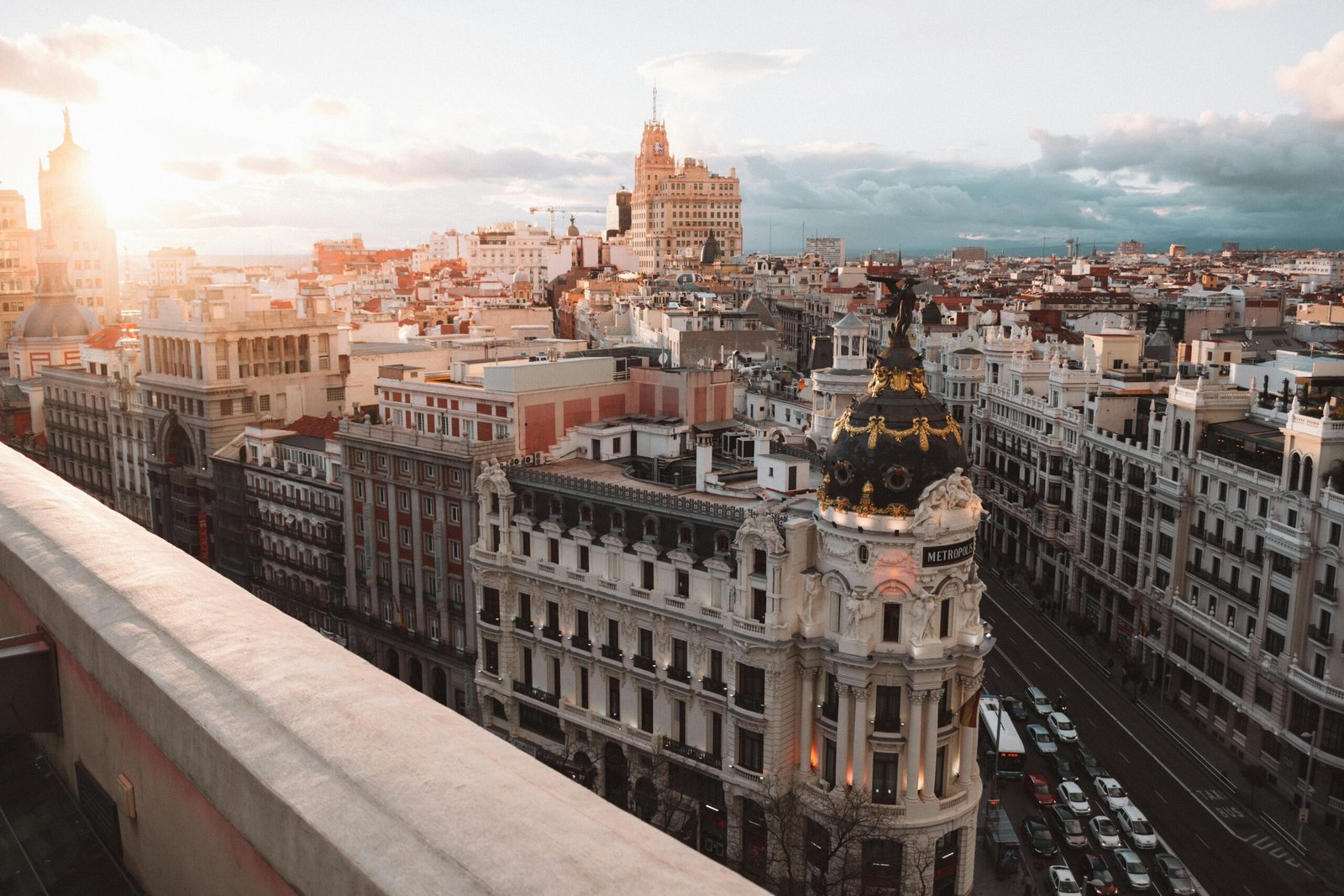 Breathtaking view of Madrid's skyline at sunset featuring the Metropolis Building.